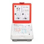 Atidarytas Reanibex 100 defibriliatorius su elektrodais